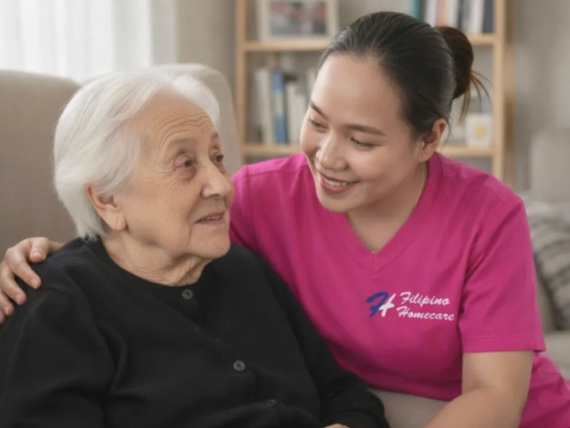 Filipino Homecare caregiver with elderly client showing compassionate care